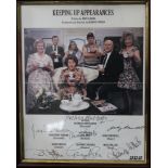 A framed picture of the cast of Keeping up Appearances, signed