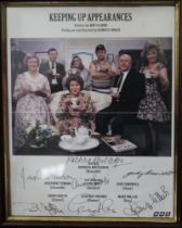 A framed picture of the cast of Keeping up Appearances, signed