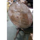 An oak topped flip top tripod table