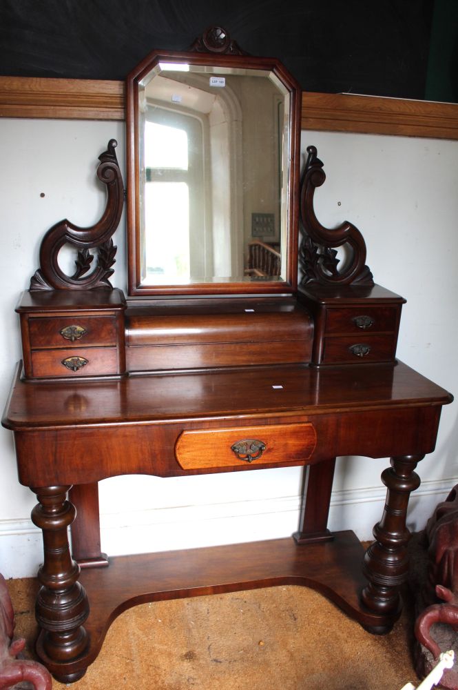 A mahogany 19th century Dutchess style dressing table with swing mirror