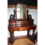A mahogany 19th century Dutchess style dressing table with swing mirror