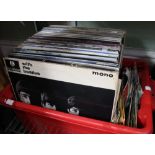 A crate containing a quantity of vintage vinyl LP's & 45's inc. Beatles etc