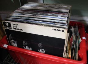 A crate containing a quantity of vintage vinyl LP's & 45's inc. Beatles etc