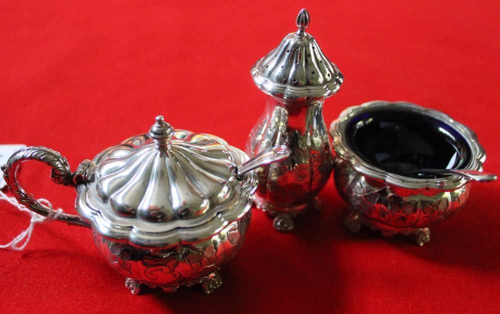 A Barker Ellis, silver plated on copper three piece condiment set, comprising salt, pepper and lidde