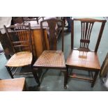 A 19th century solid seated oak country chair together two others bedroom style chairs