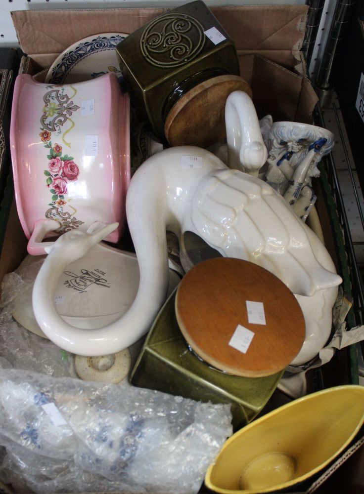 A box containing a good selection of useful and collectible ceramics, swans, storage jars etc