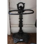 A black cast iron stick stand