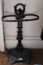 A black cast iron stick stand