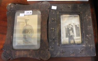 Two wooden folk art picture frames with contents