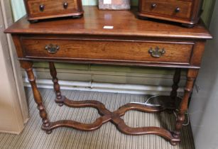 An oak hall table with single drawer on turned legs with fancy stretcher,
