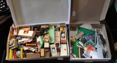 A box containing a good selection of vintage dolls house furniture with a child's garden