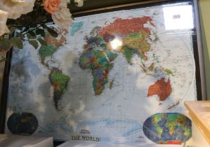 A large framed and glazed colour map of the world 120 x 80 cm