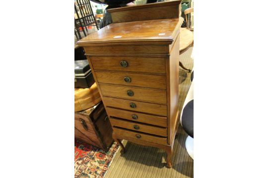 An early 20th century Lidstone seven drawer music cabinet