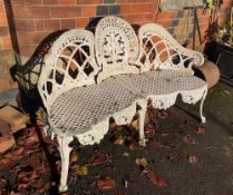 A cast ornate three seater garden bench