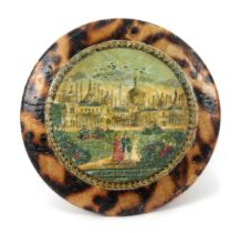 A whitewood print decorated Tunbridge ware pin cushion on ribbon suspension, in burnt wood to