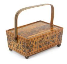 A whitewood print and paint decorated Tunbridge ware rectangular sewing pannier, raised on brass