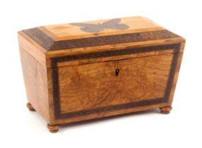 A golden figured oak Tunbridge ware tea caddy, of sarcophagol form, the front with a geometric