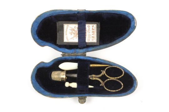 A mother of pearl sewing companion formed from a pearl sea shell, circa 1880, white metal fancy - Image 1 of 2