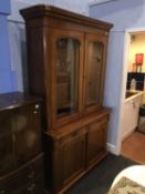 A Victorian mahogany bookcase with two glazed doors and panelled doors below