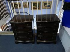 A pair of reproduction mahogany serpentine four drawer chests, W 52cm