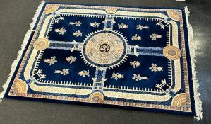 A large blue ground Chinese design carpet square