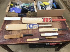 Collection of signed cricket bats etc.