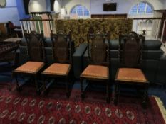 A set of four canework and barley twist oak dining chairs