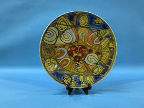 A large Poole pottery Sun Face charger, diameter 36cm