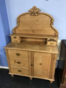 An antique pine side cabinet