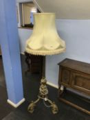 A heavy decorative brass adjustable standard lamp