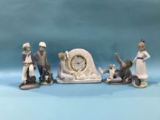 Lladro clock group and a figure of a young sailor and three Nao figures