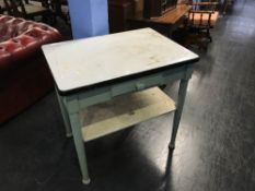 A painted pine kitchen table with white enamelled top