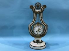 A decorative French marble lyre shape clock with enamelled dial, eight day movement and strike