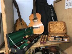 Acoustic guitar, piccolo recorder, descant recorders and a cased bass recorder etc