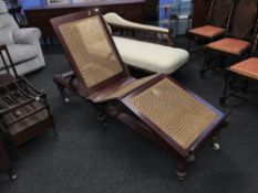 A 19th Century mahogany bergere campaign day bed, by Robinson and Sons of Ilkey