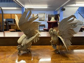 A large pair of gilt metal prancing cockerels