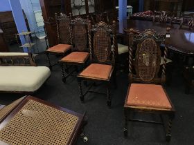 A set of four oak barley twist dining chairs