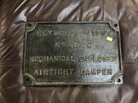 Two cast iron wall plates 'Flexi Press' and 'Heywoods Patent'