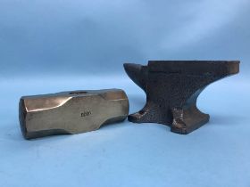 An 8kg brass miners sledge hammer head and a small anvil