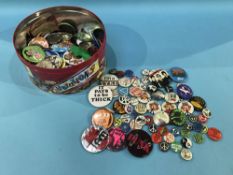 A collection of vintage pin badges
