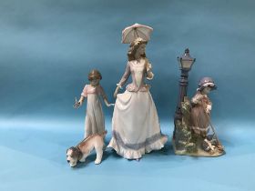 Two Lladro figures, a Lladro dog and a Nao figure of a girl