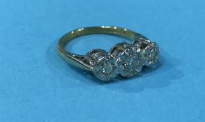 An 18ct three stone diamond ring, 3.5g, size 'M'