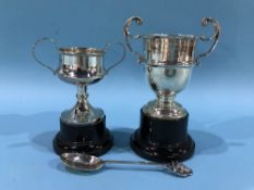 Two silver cups and a spoon