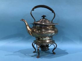 A silver spirit kettle and stand, 1342g, Thomas Edward Atkins, Birmingham, date marks rubbed, 43 oz