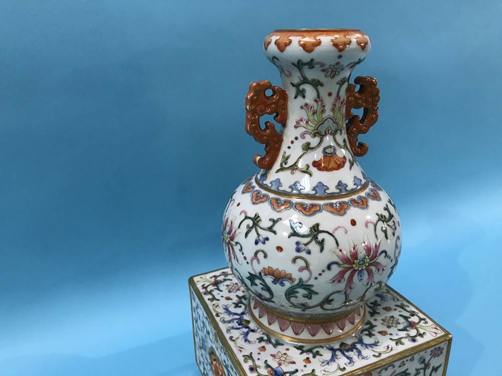 An unusual Chinese Famille Rose two handled vase, supported on a square and pierced base, mark in - Image 3 of 17