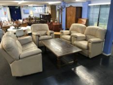 A leather three piece suite with a matching reclining armchair