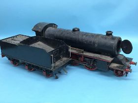 A 3.25" gauge live steam locomotive and tender, in black livery