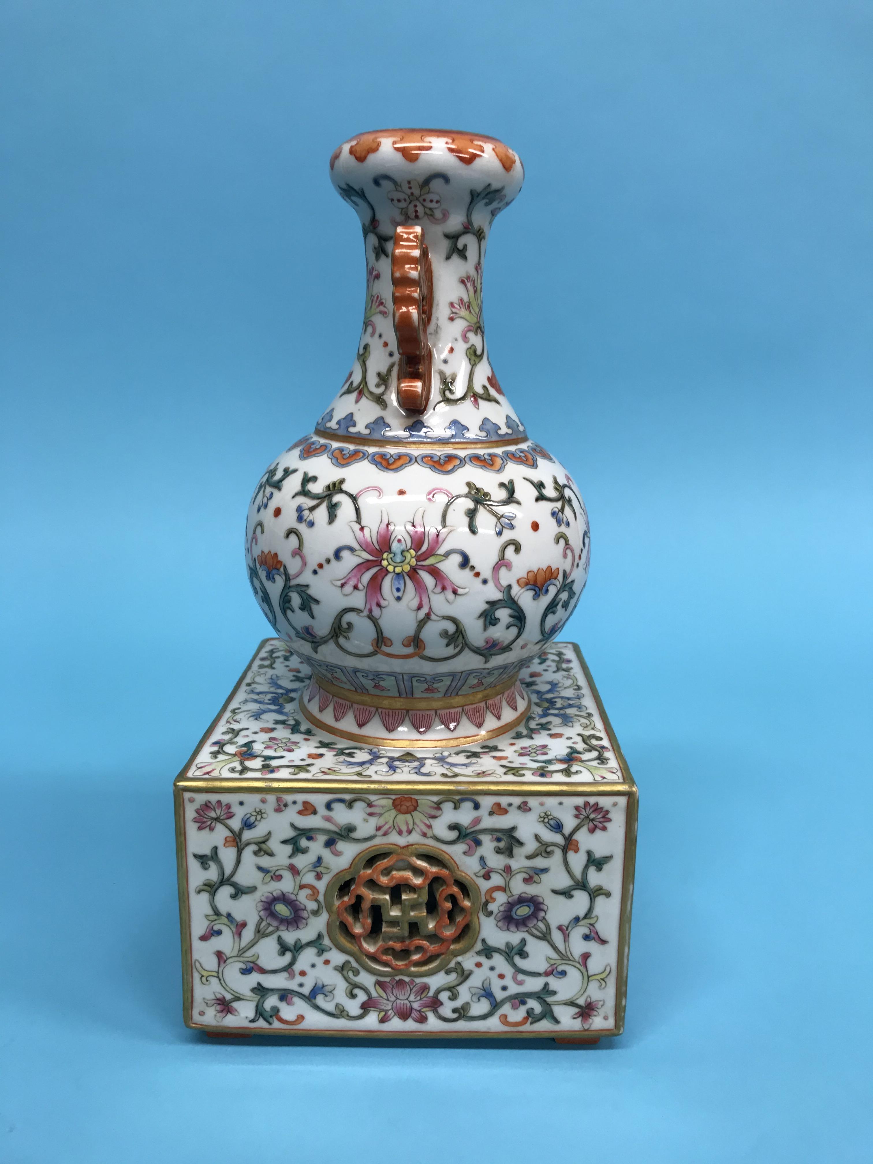 An unusual Chinese Famille Rose two handled vase, supported on a square and pierced base, mark in - Image 11 of 17