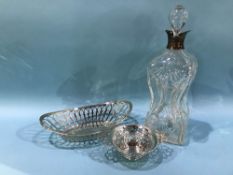 Two silver baskets and a silver mounted cut glass dimple decanter