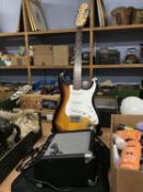 A Fender Starcaster, bag and amp
